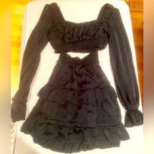 Brand new black 2-piece set with skirt and long-sleeve crop top. Never worn!